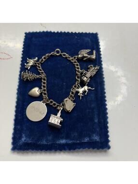 Sterling charm bracelet with 9 charms vintage 1960s